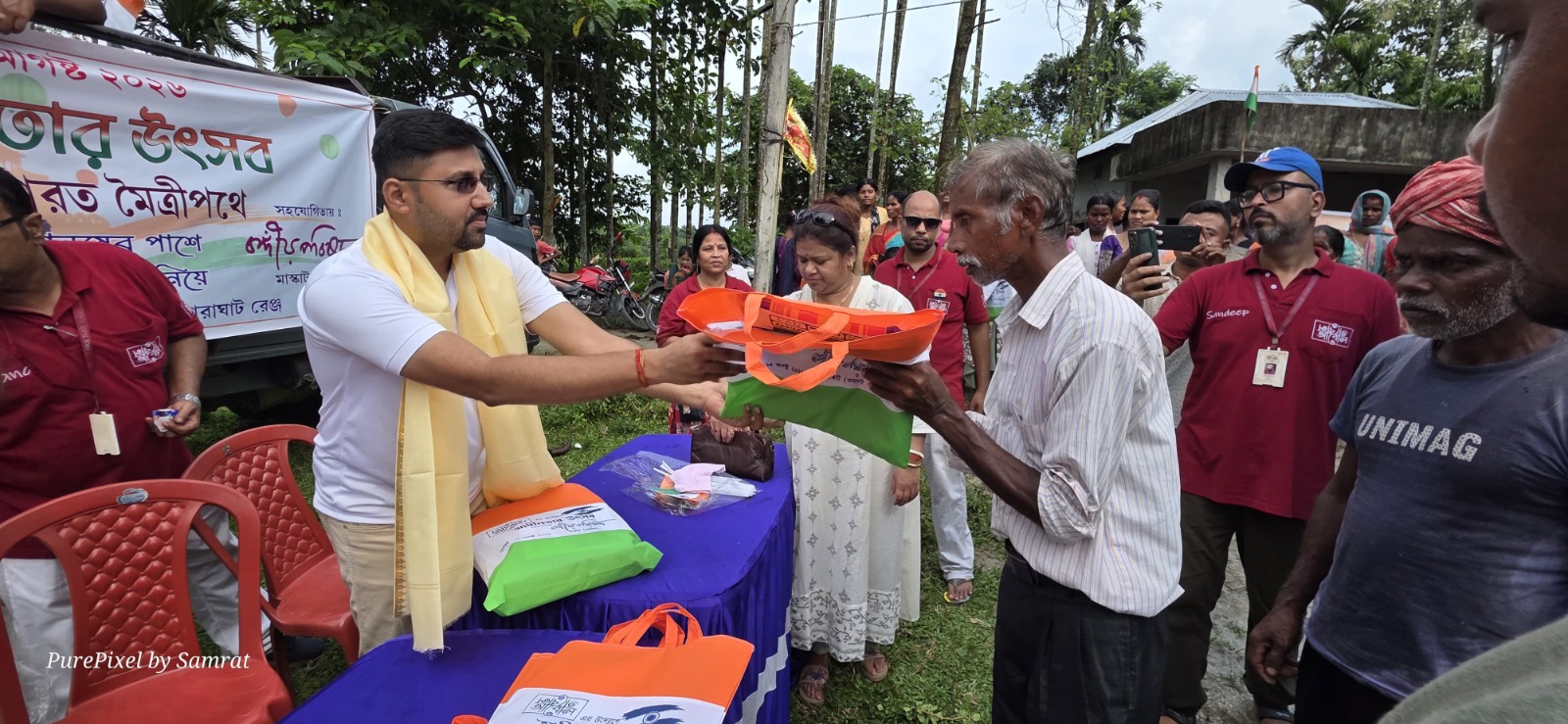 A resident receiving a new clothing package during the Independence Day programme