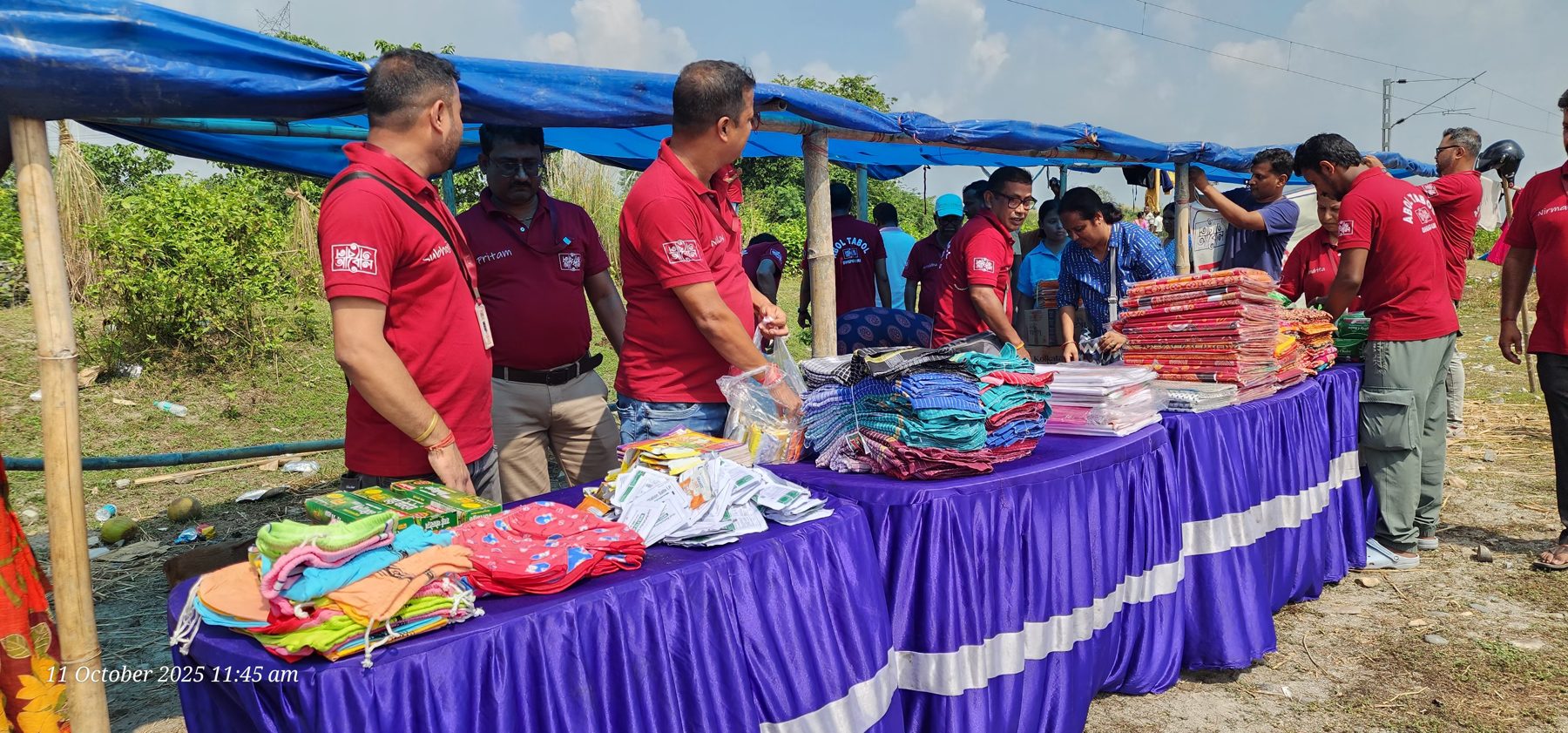 New clothes laid out on a table at a flood relief distribution point