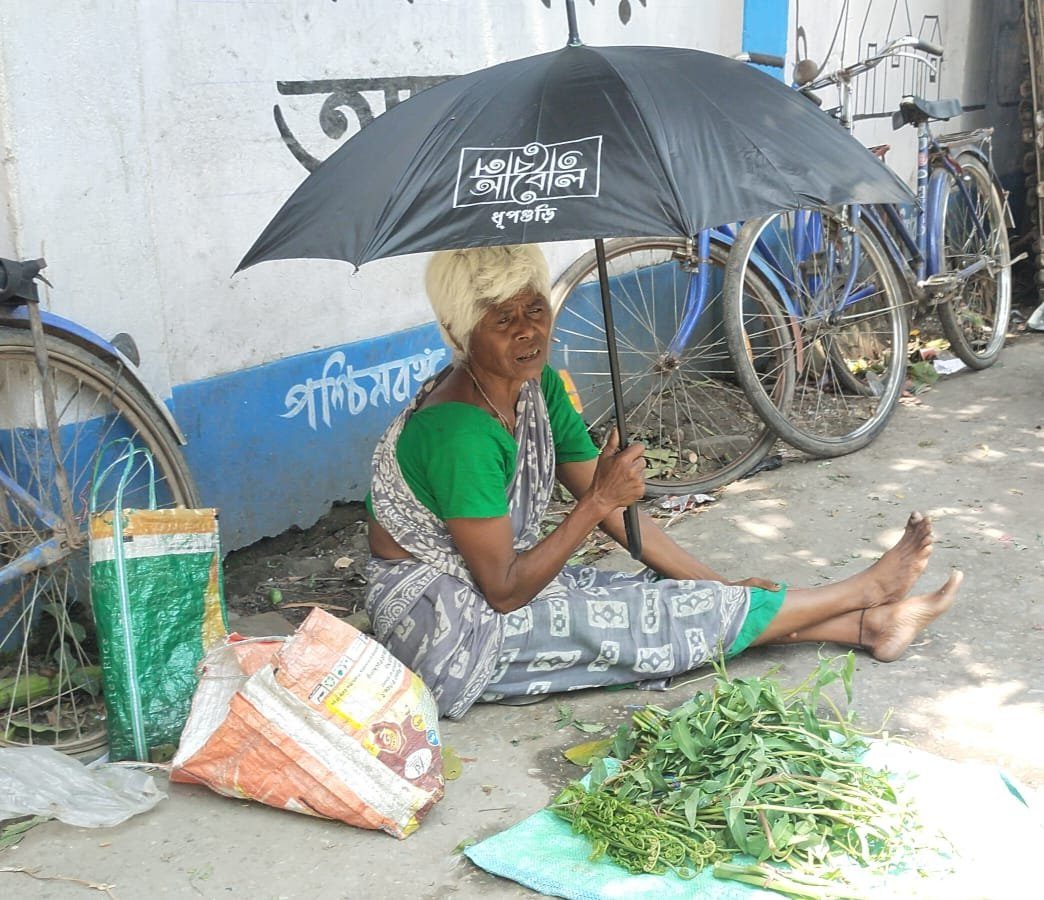 Street vendor shaded by an Abol Tabol umbrella